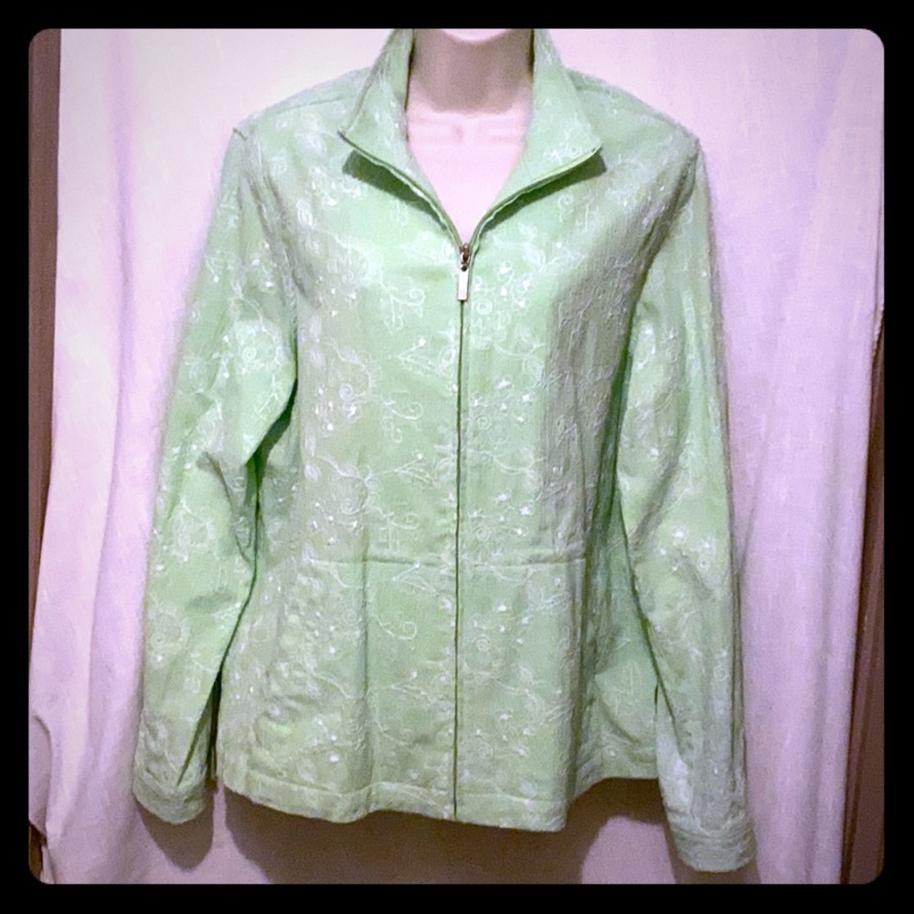 Light woman’s jacket.  Light green with white.